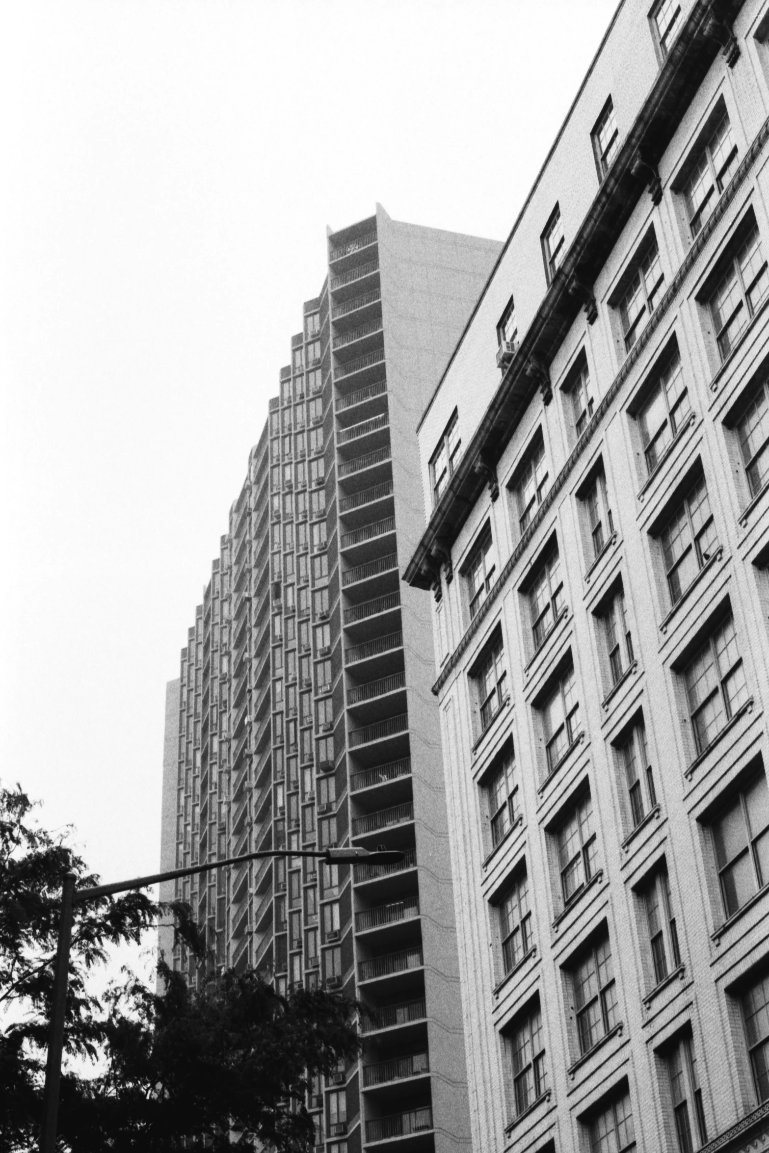 black and white pograph of two large buildings