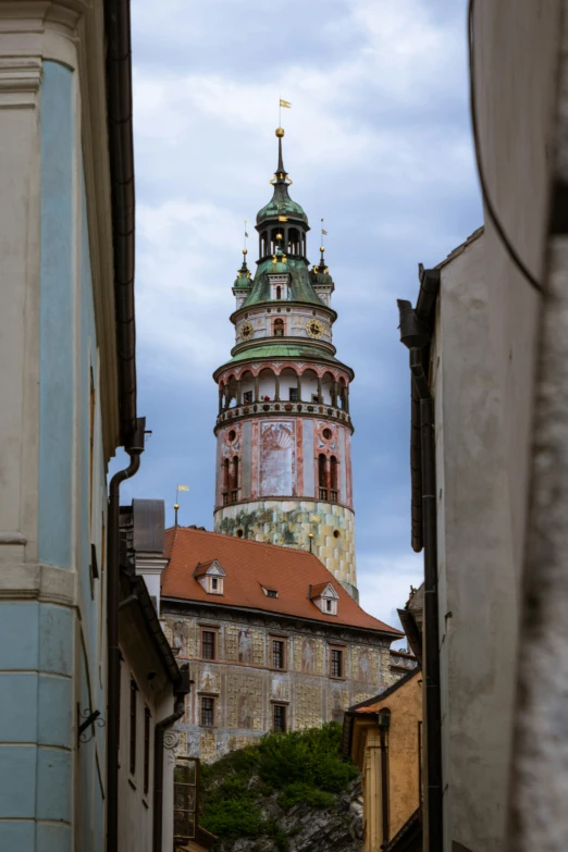 an old tower that has a cross on top