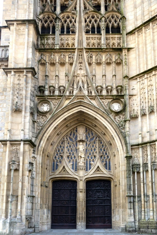 an old building with an ornate doorway and clock