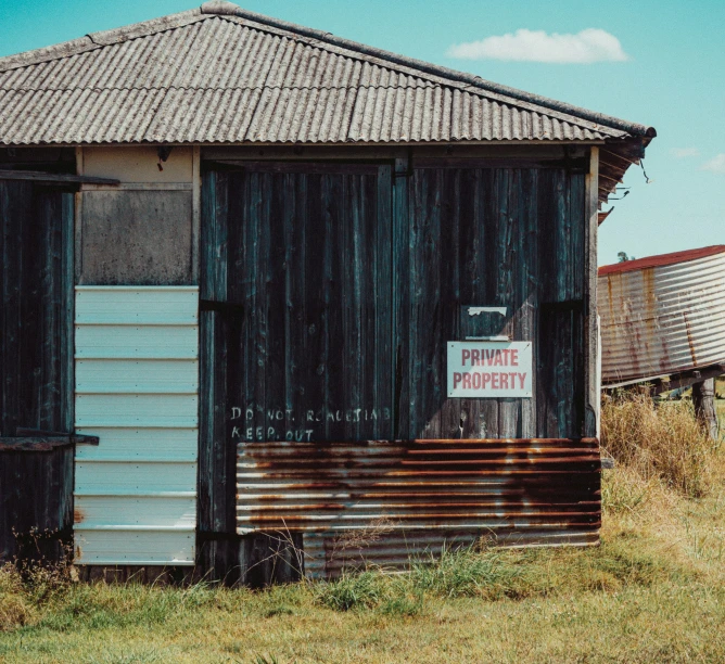 this shack has a sign on it outside