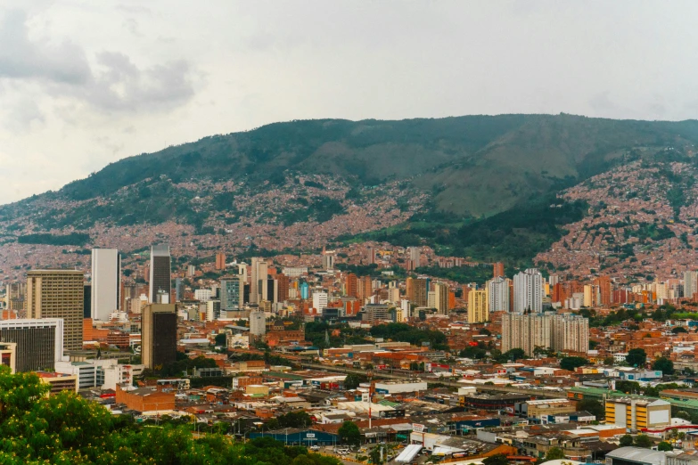 an aerial view of a city and mountains