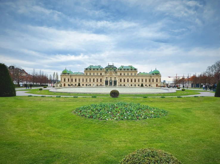 a beautiful and large building with green roof