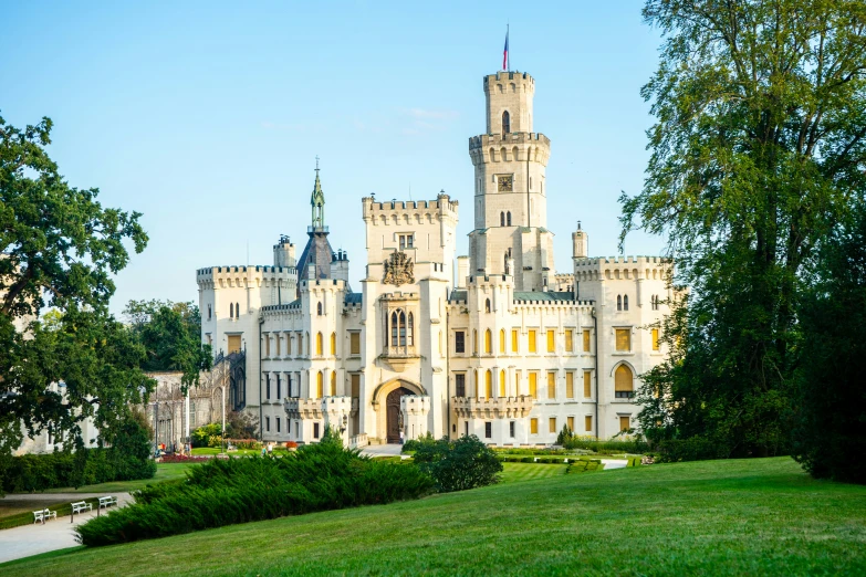 a castle on a hill with several trees