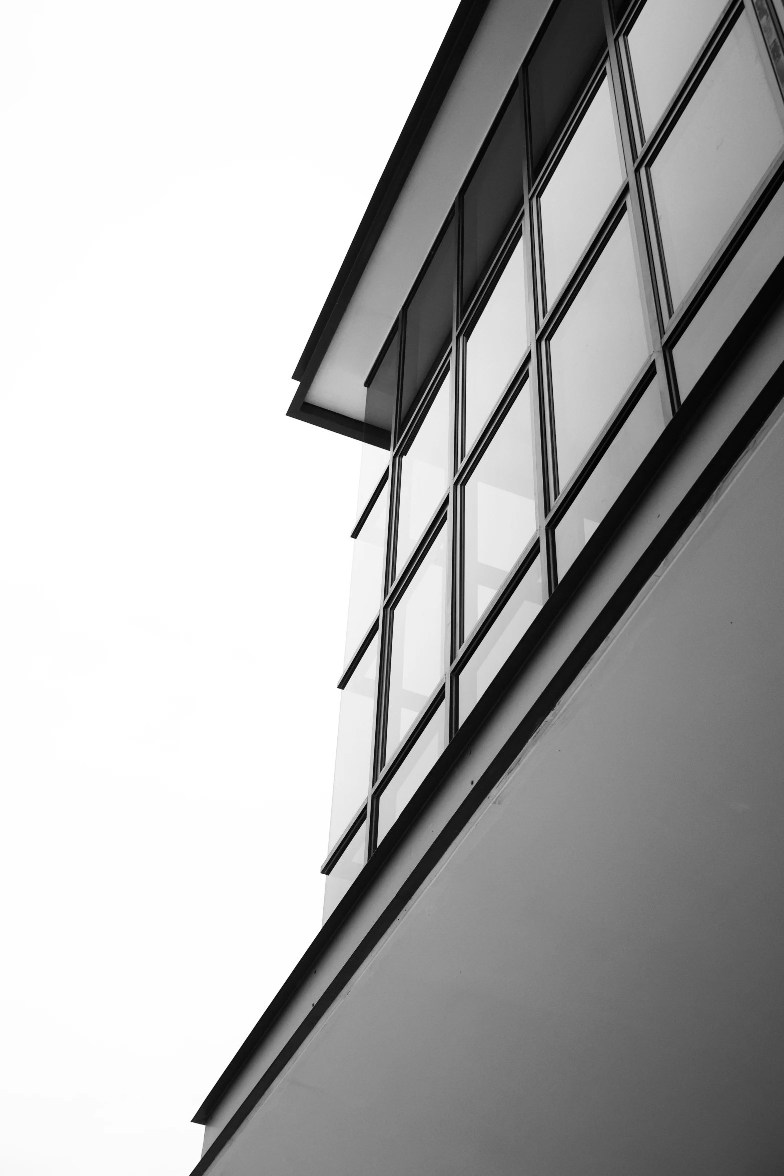 the window of an older building with a sky background