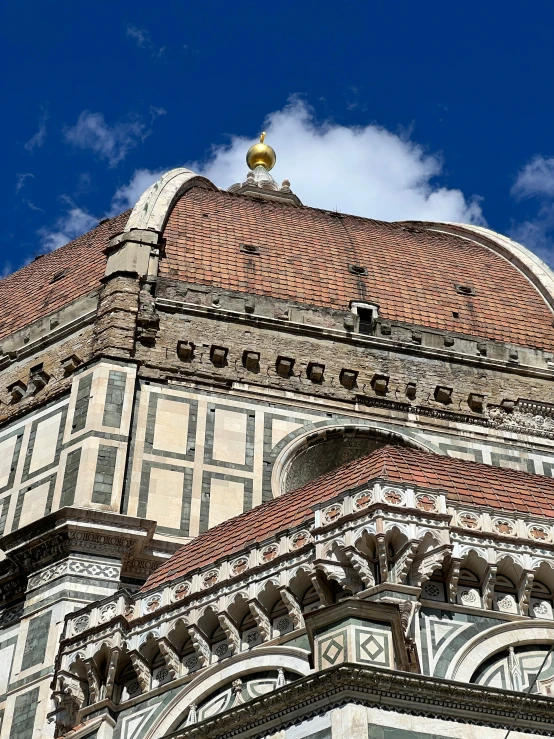 a tall building with ornate architecture on top