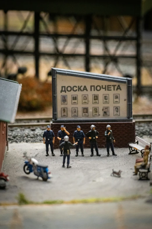 toy police officers stand in front of a small set of cars and planes