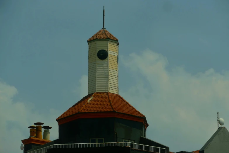 there is a clock tower and a building in the background