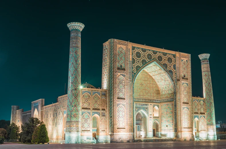 the large building is lit up with many lights