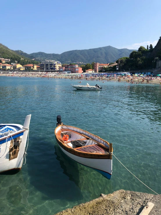 two small boats moored in shallow waters