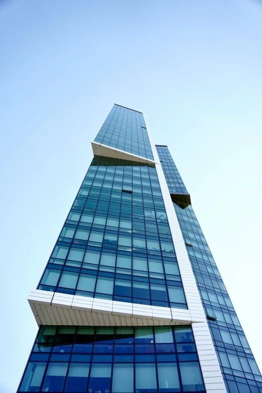 a tall, blue building with some windows