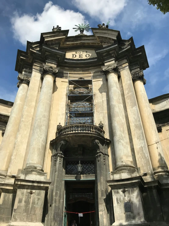 the entrance of a building with pillars and a doorway