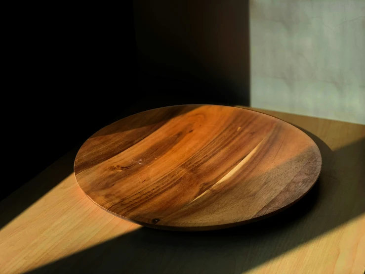 a wooden platter is shown on the counter