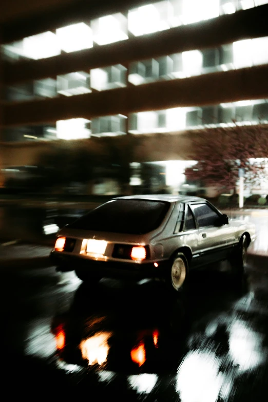 car coming through a street with it's lights turned on