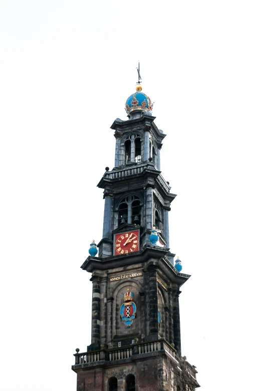 a tower of a building with a clock on the top