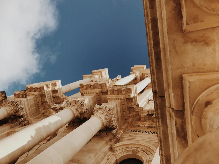 looking up at a large castle like structure that is taller than it itself