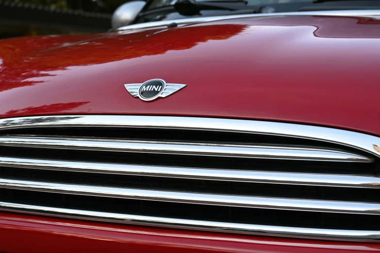 a close up view of the grille of a red car