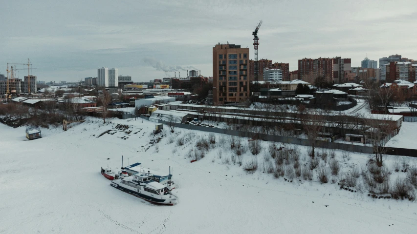a city skyline in winter with snow on the ground