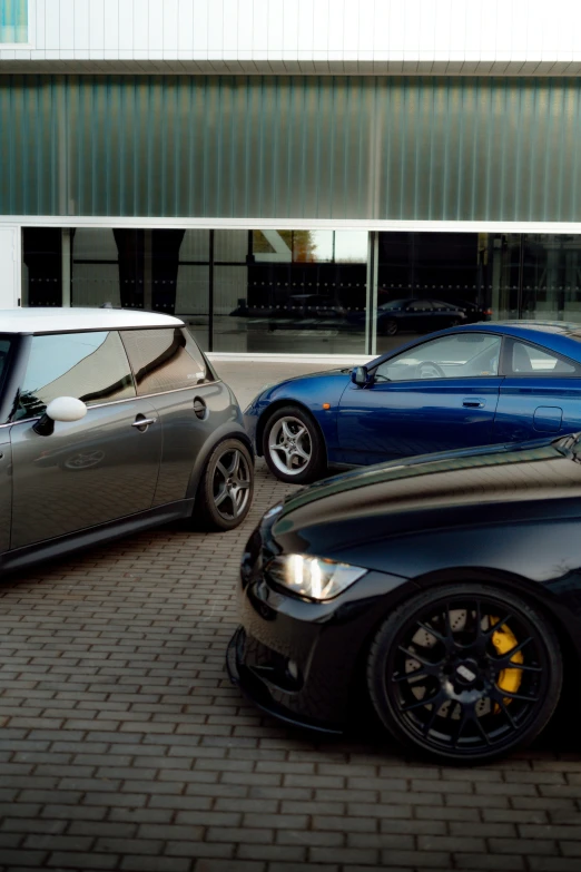 a couple of cars parked next to each other on a street