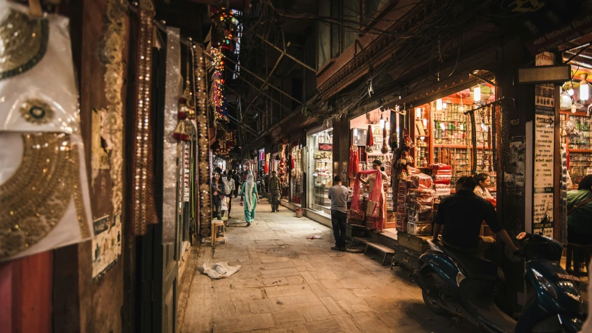 people are looking at items displayed in a market