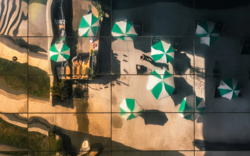 aerial s of a group of umbrellas spread around on the ground