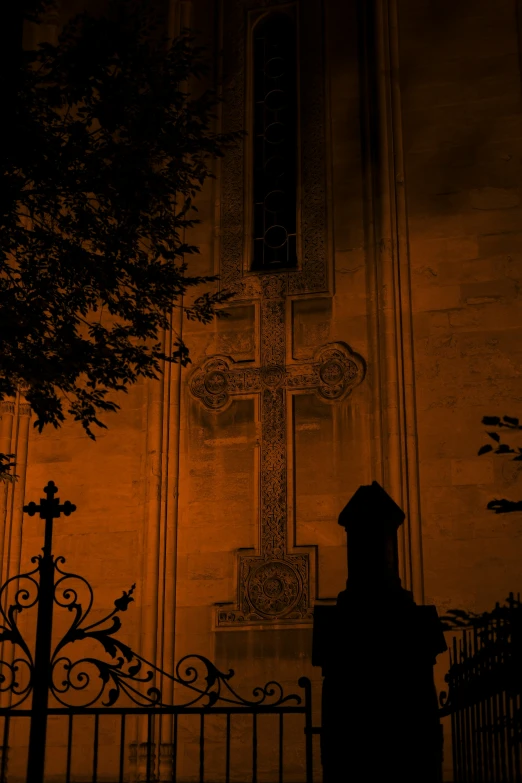 a silhouette of a woman in front of a church