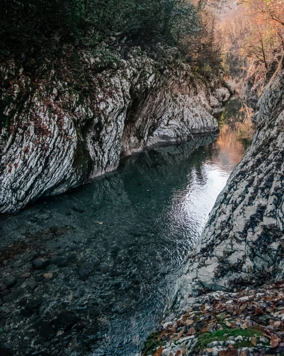 the river is flowing through a narrow canyon