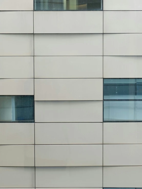 an exterior view of an office building with multiple windows