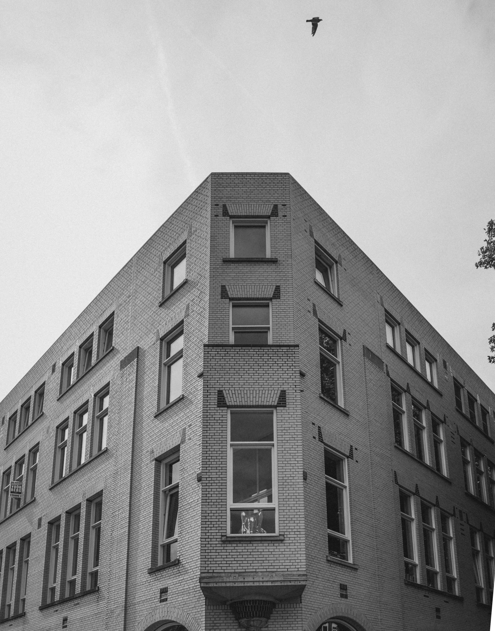 an old po of an apartment building in black and white