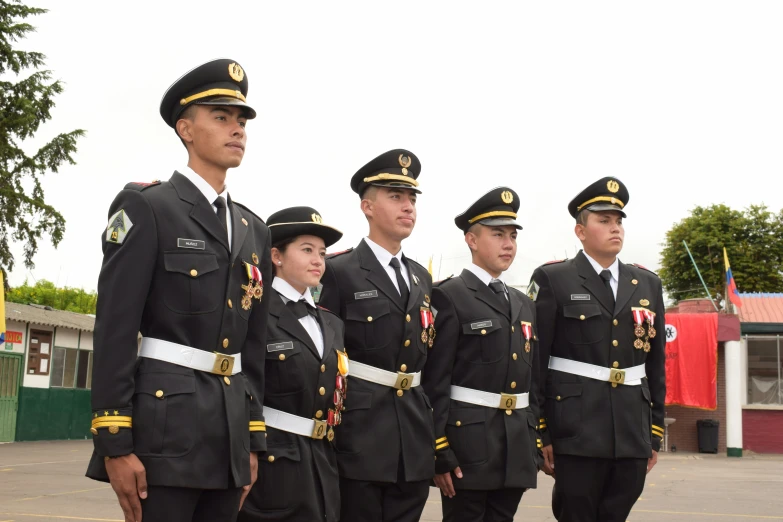 several military officers in uniform standing together