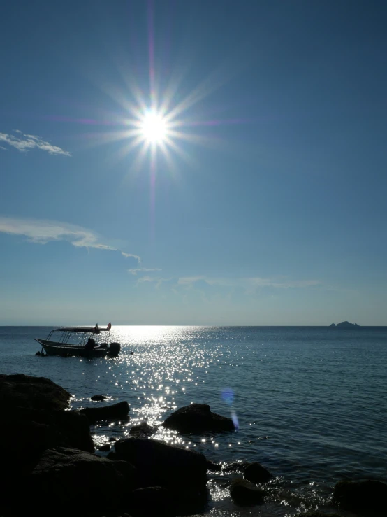 some boats are parked in a bay at sun