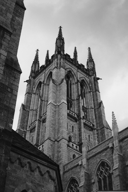 an old gothic building with a tall steeple