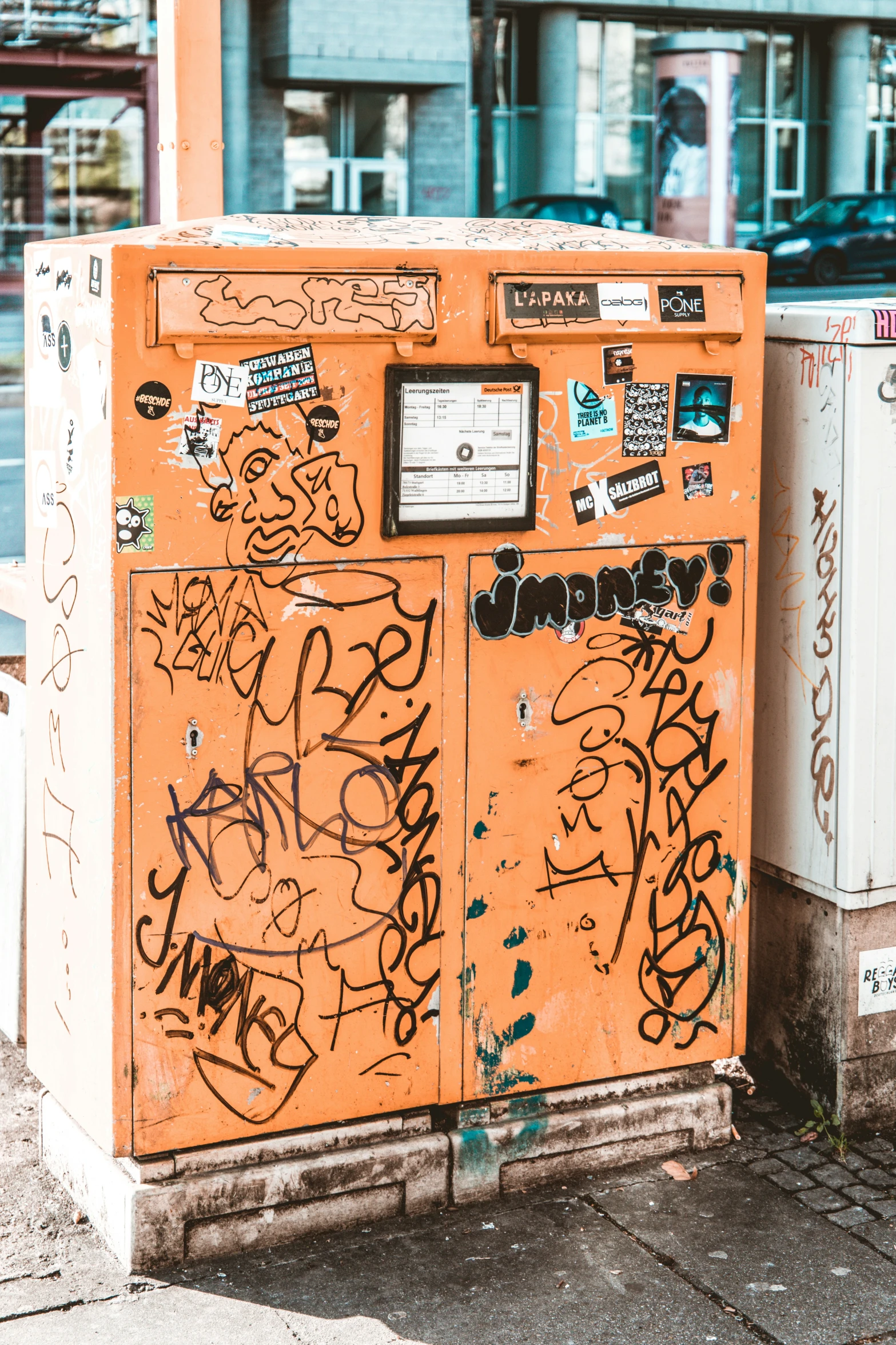 a bunch of graffiti on the side of a wall