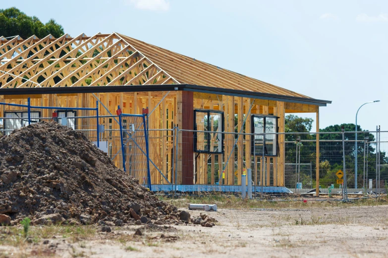 a building with construction materials surrounding it