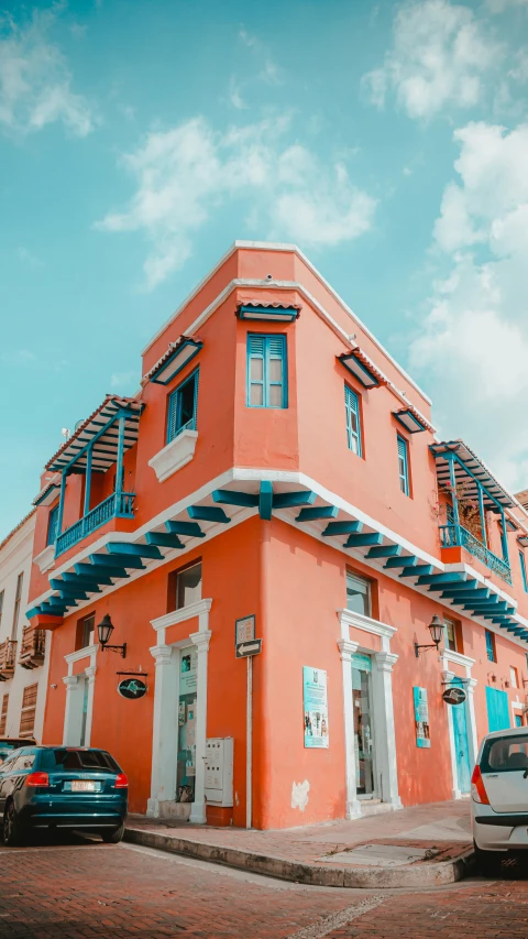 the orange building has blue and white striped roofs