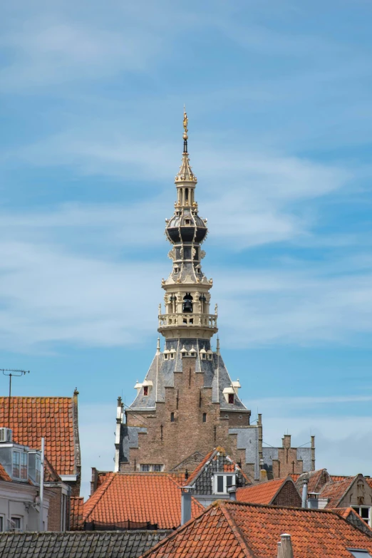 the steeple of a church on top of a building with no roof and the tops are red tiled