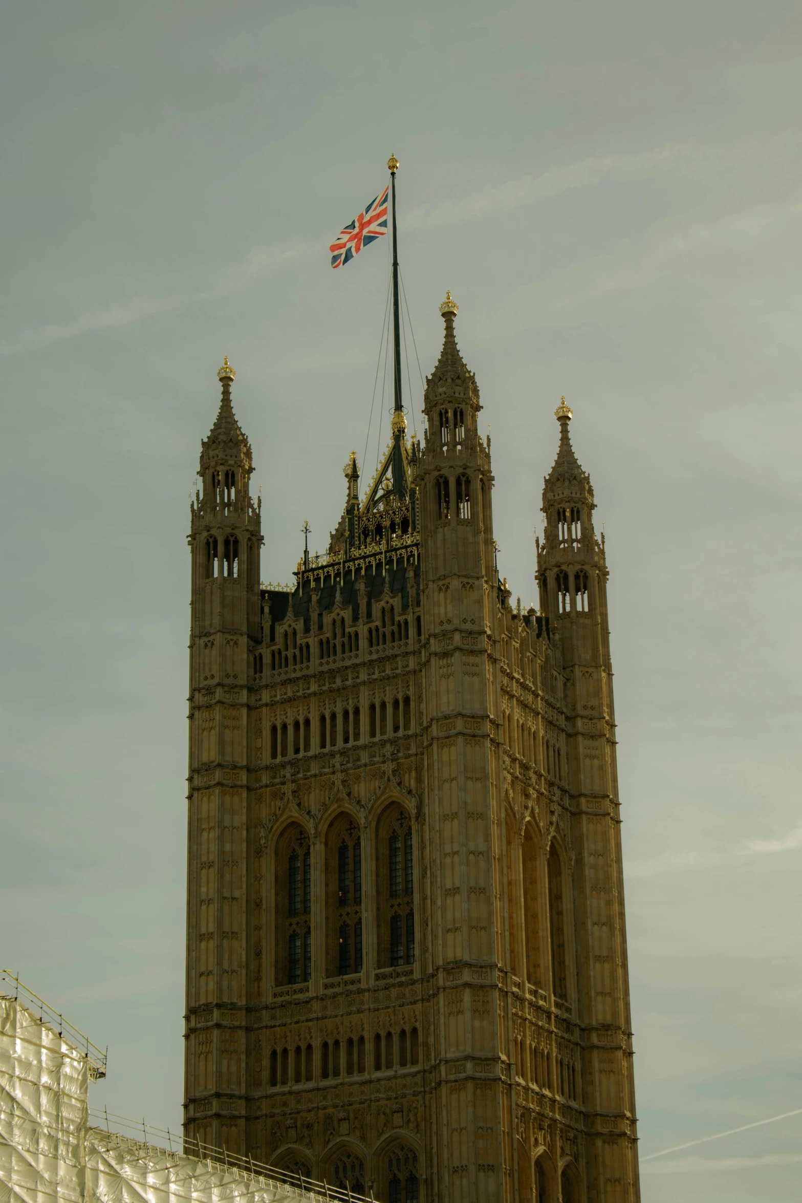 the large tower has a flag on top