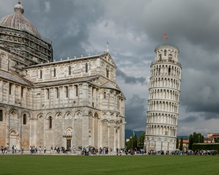 several buildings and a tower with people around it