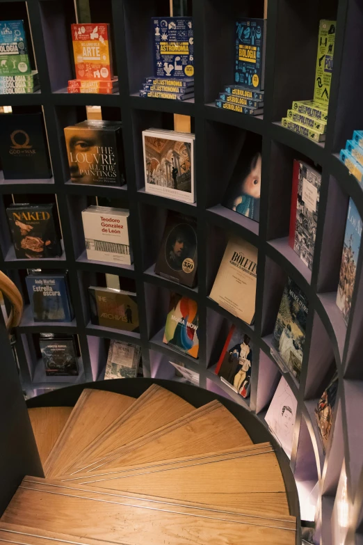 bookshelf with books and other items stacked in it