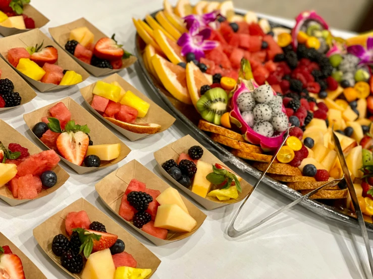 many trays with different types of fruits on them