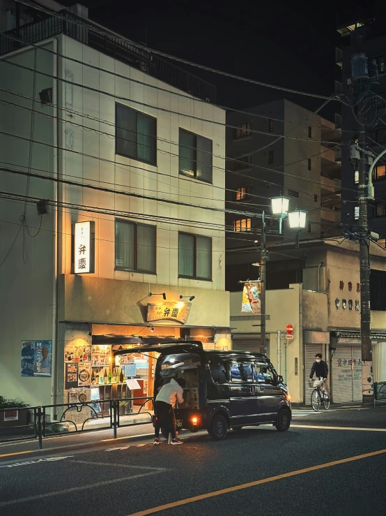 a truck and some buildings at night time