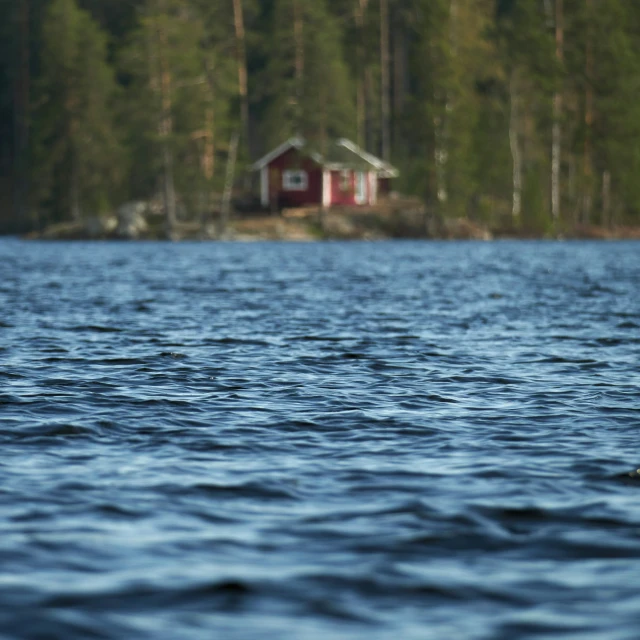 a boat floats through the water near trees