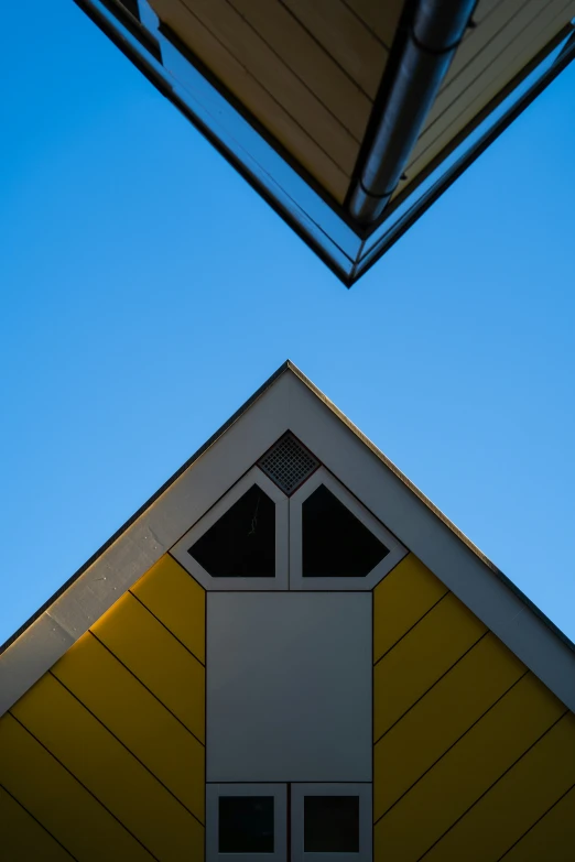 there is a large building with a bright yellow roof