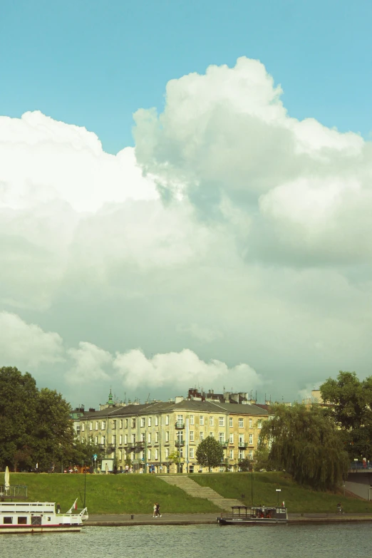 a yellow building near a body of water