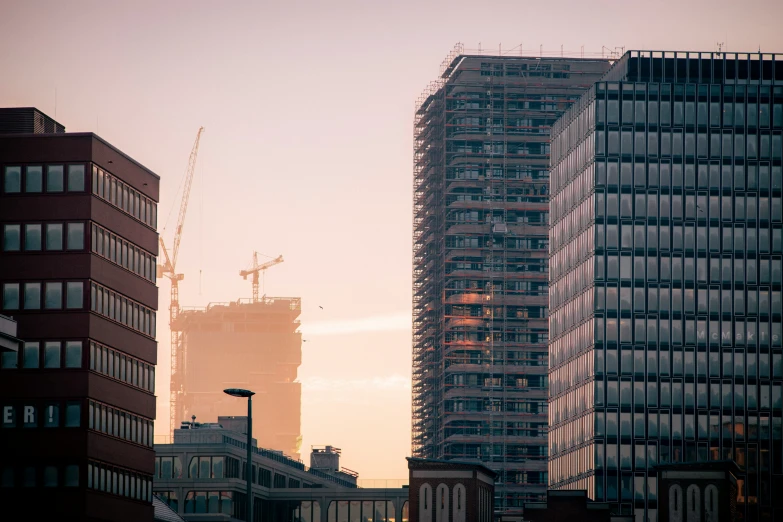 some buildings and one has a tall clock tower