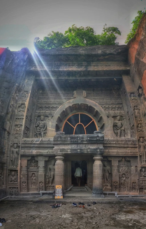 a large stone building with a small gate in it