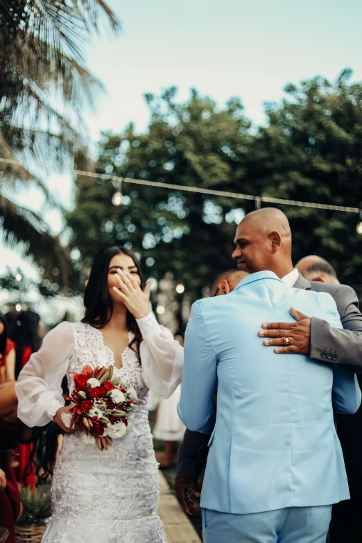 a couple on their wedding day are walking down the aisle