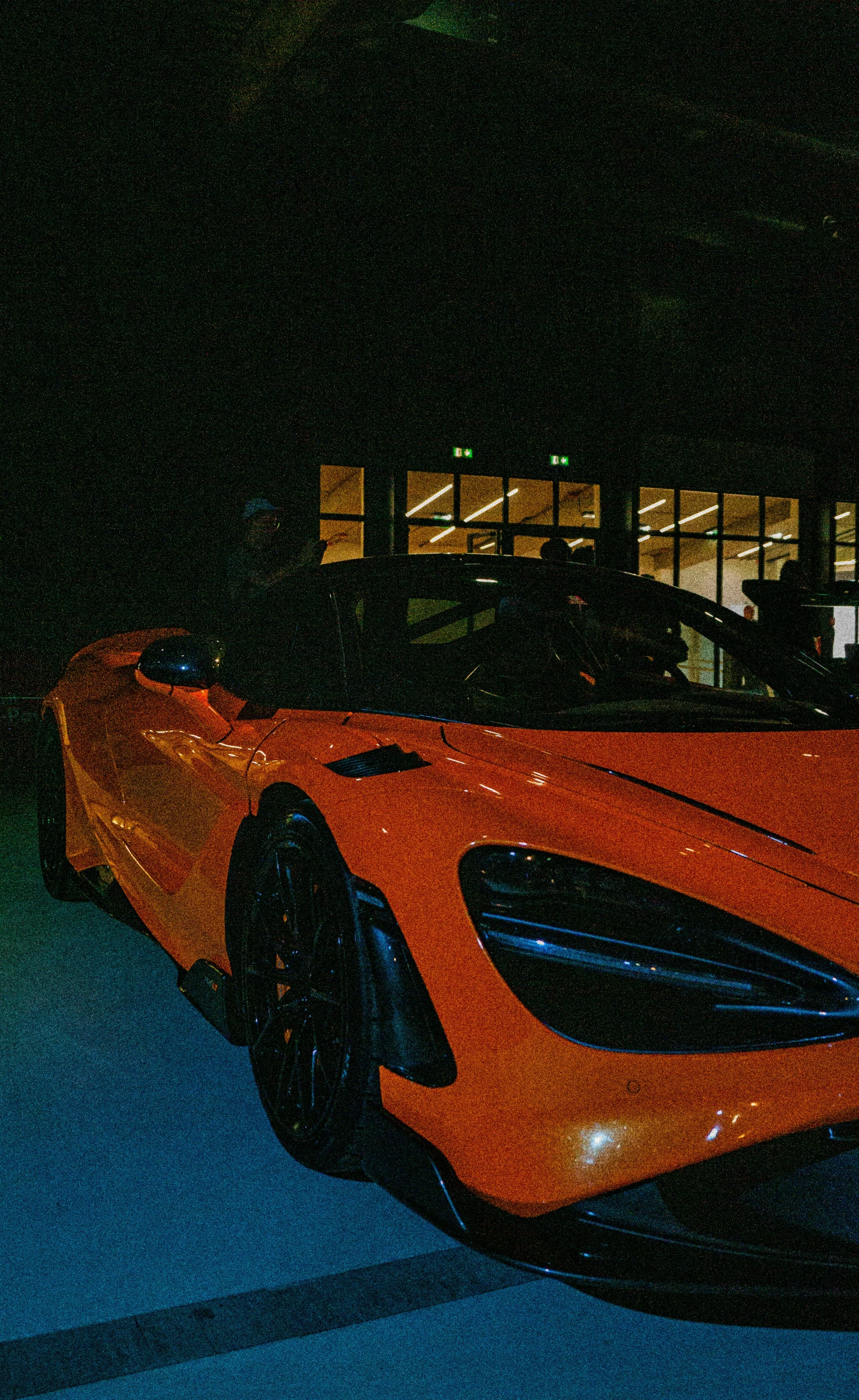 a very nice looking sports car in the dark