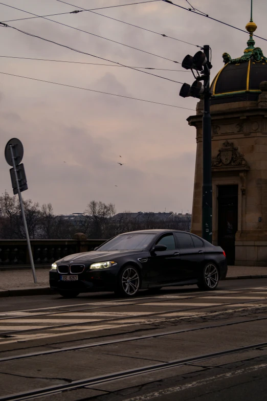 a car in front of a building on the street