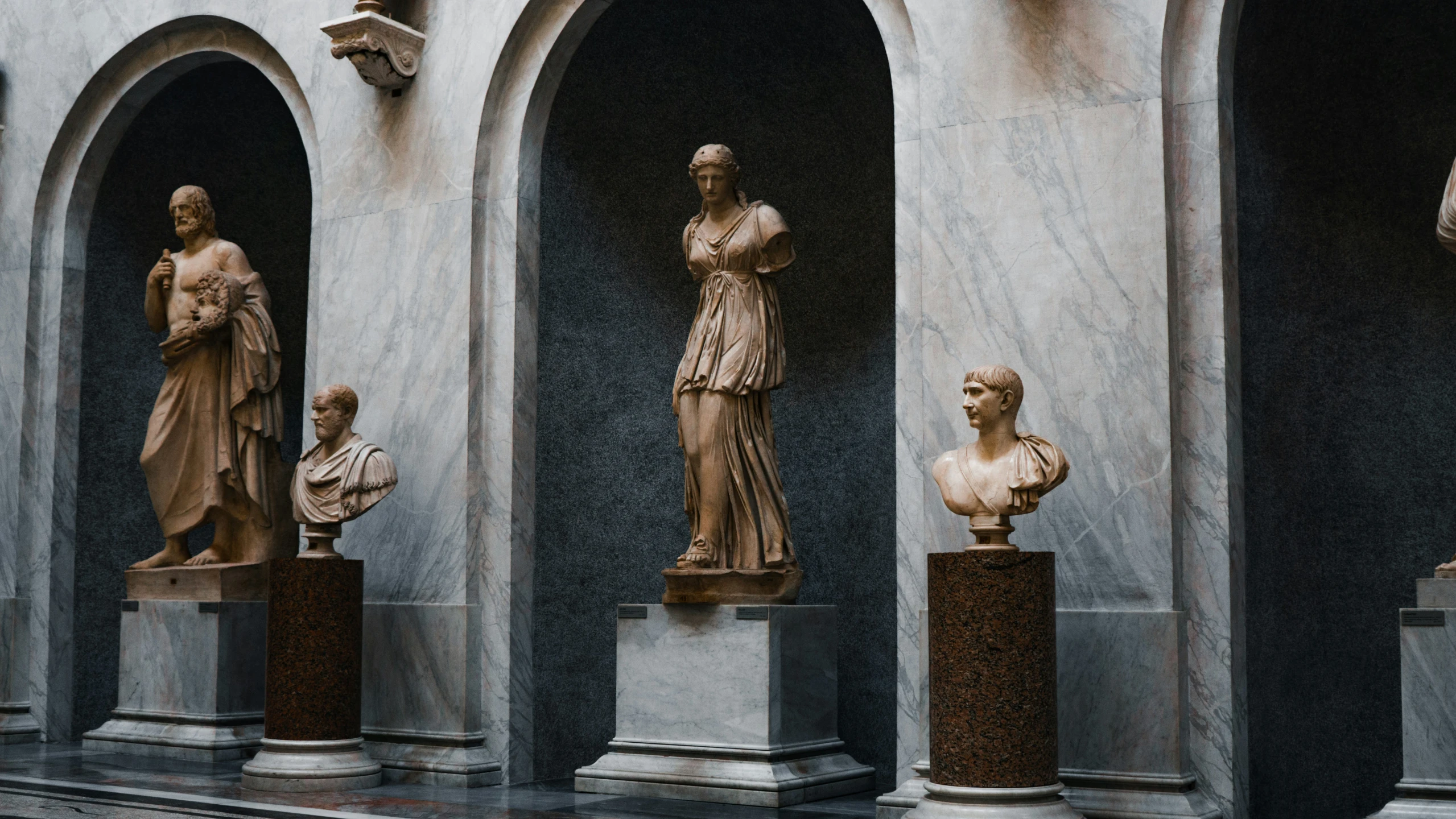 the statues are lined up on the pedestals