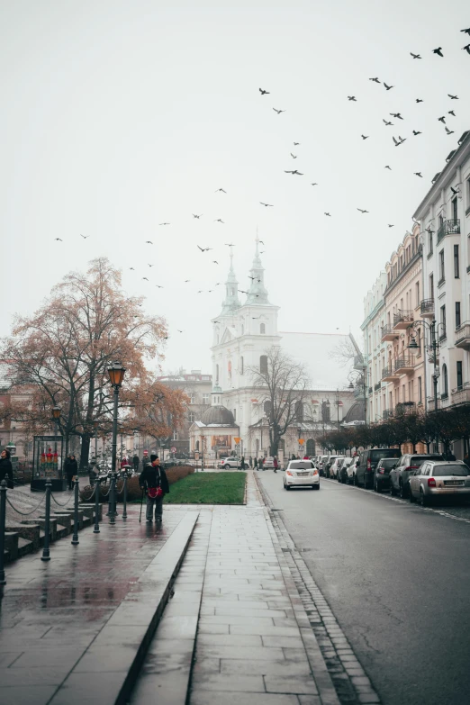 a busy street with a few people walking along it